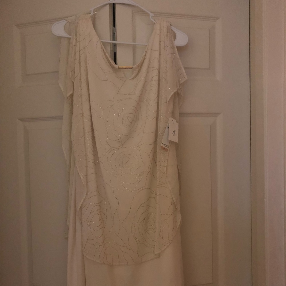 Beautiful white pearl dress tags on. Never used.
